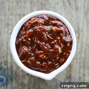 Ssamjang Korean Spicy Dipping Sauce is as easy as it is delicious and habit forming! Serve as a dip for Korean Barbecue, pork roasts, bo ssam, on lettuce wraps, or any other number of delicious things!