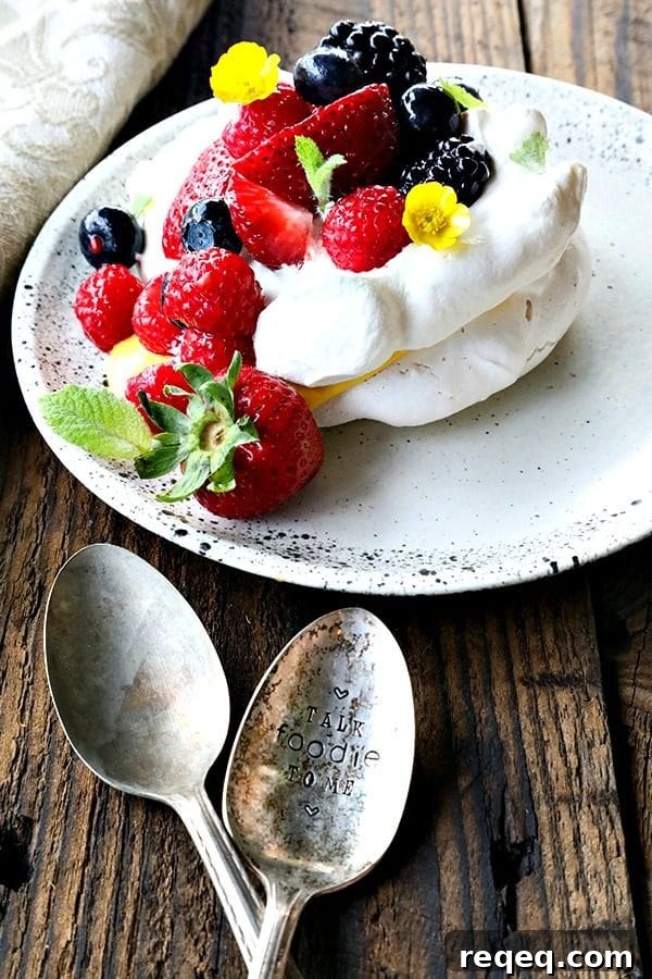 Ethereally light, crisp on the outside, marshmallowy on the inside, this Mini Pavlova Recipe is foolproof and ready for summer!