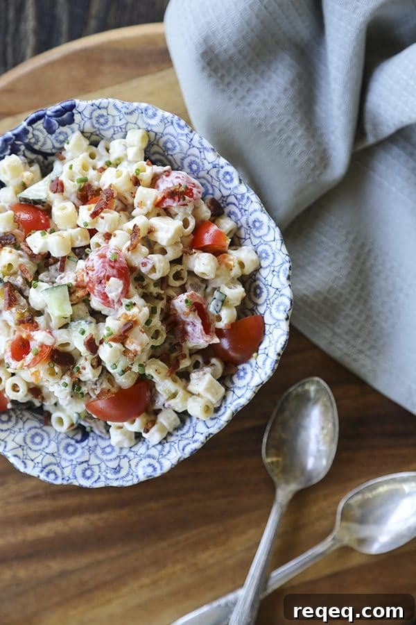 Spicy Bacon Cheddar Pasta Salad Recipe with Creamy Dressing 4 Tender, little ditalini, crunchy yellow and orange bell pepper, cucumber, crispy bacon crumbles, tiny cubes of Cheddar and pepper jack cheese, and minced fresh jalapeño pepper and chives in a creamy ranch dressing make this Spicy Bacon Cheddar Pasta Salad recipe scream summer!