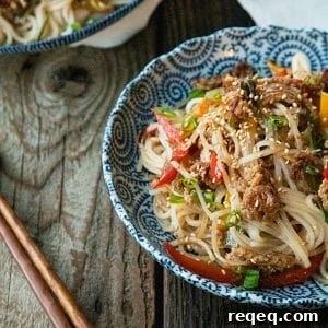 Crispy Pork Noodles with Garlic and Ginger Sauce 4 Easy Garlic Ginger Crispy Pork Noodles are going to be your new favourite dinner. Crazy simple. Crazier delicious. And easy on your pocketbook to boot. This delicious meal-in-one whips up in less than 30 minutes.