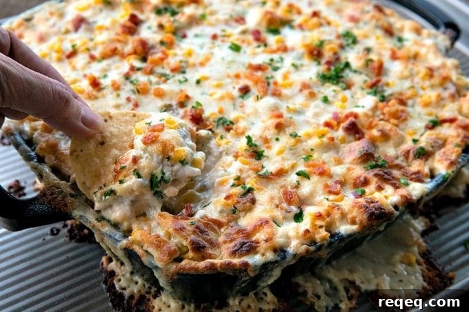 Creamy Baked Corn Dip with Cheesy Jalapeño Topping 4 Hot corn dip is chock full of sweet corn, tender chicken, crispy, smoky bacon, hatch chiles, and green onions in a bubbling, creamy, ranch cheese sauce.