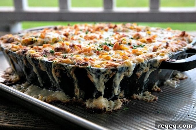 Creamy Baked Corn Dip with Cheesy Jalapeño Topping 5 Hot corn dip is chock full of sweet corn, tender chicken, crispy, smoky bacon, hatch chiles, and green onions in a bubbling, creamy, ranch cheese sauce.