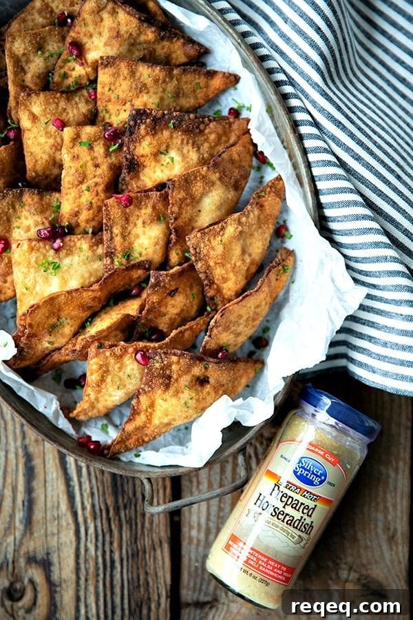 Crispy Crab Rangoon Recipe: Creamy Crab Wontons for Parties 2 Crispy, crunchy wontons stuffed with an irresistible filling of cream cheese, crab meat, savoury bacon, and zingy horseradish make this a great twist on the classic Crab Rangoon.