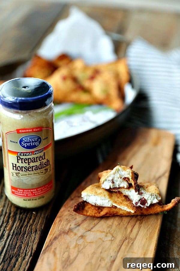 Crispy Crab Rangoon Recipe: Creamy Crab Wontons for Parties 3 Crispy, crunchy wontons stuffed with an irresistible filling of cream cheese, crab meat, savoury bacon, and zingy horseradish make this a great twist on the classic Crab Rangoon.