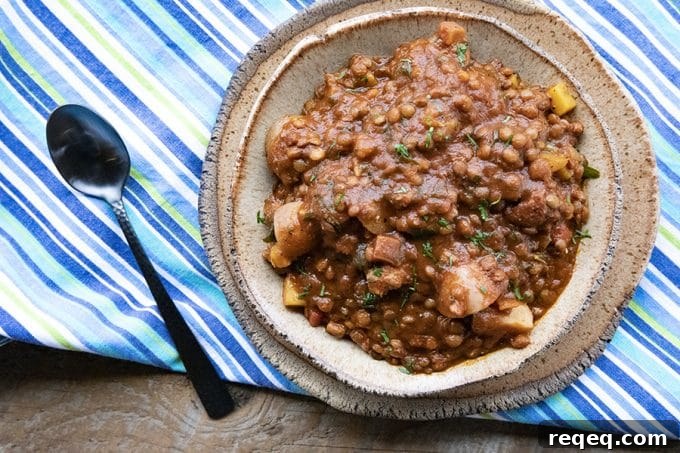 Smoky Chorizo Chili Recipe for Hearty Weeknight Dinners 7 Chorizo Chili is hearty, spicy, slow-simmered chorizo in smoky tomato sauce with tender potatoes, carrots, and lentils. This is serious comfort food!