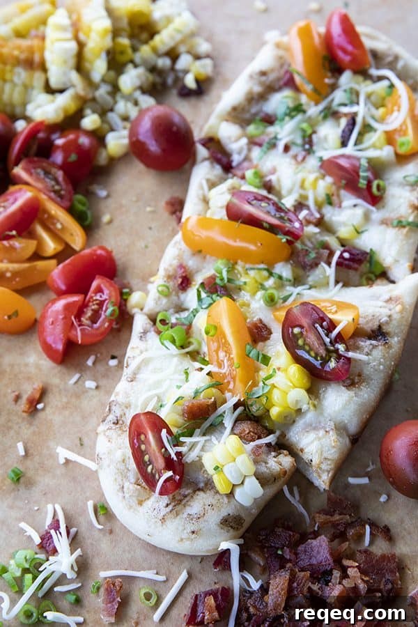 Crispy Grilled Flatbread Recipe for Charred, Fluffy Bread 2 freshly grilled flatbread with bacon, corn, tomatoes, and cheese