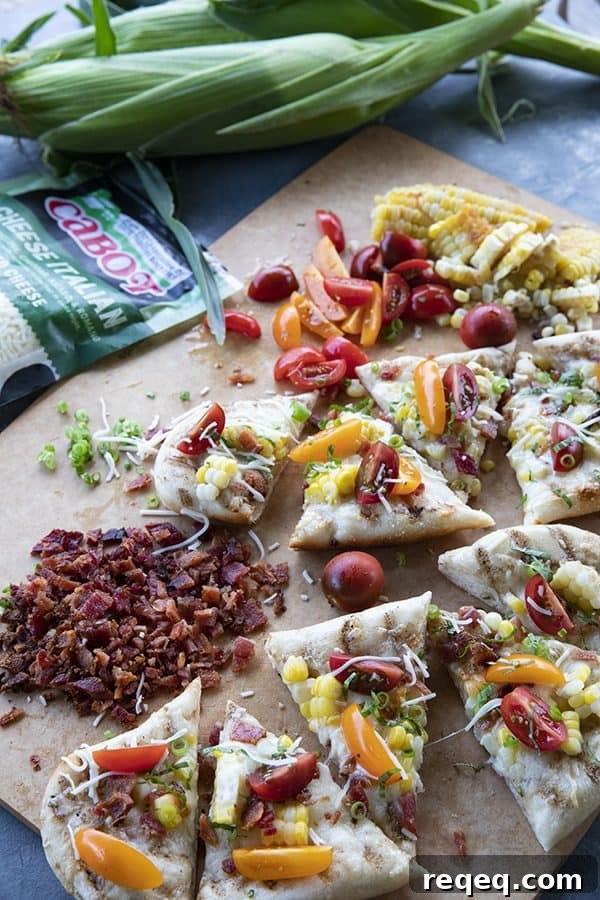 Crispy Grilled Flatbread Recipe for Charred, Fluffy Bread 3 grilled flatbread with bacon, corn, tomatoes, and cheese on a cutting board