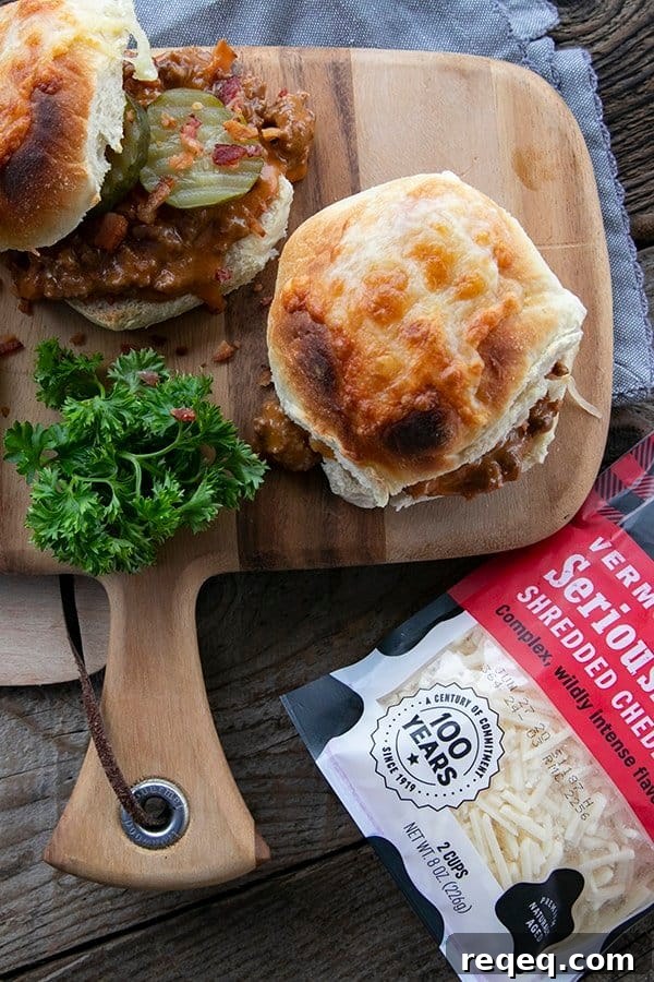 Classic Homemade Sloppy Joes Recipe for Juicy Sandwiches 2 rich tomato gravy with melted Cabot cheese and crispy chopped bacon on a toasted bun with dill pickles
