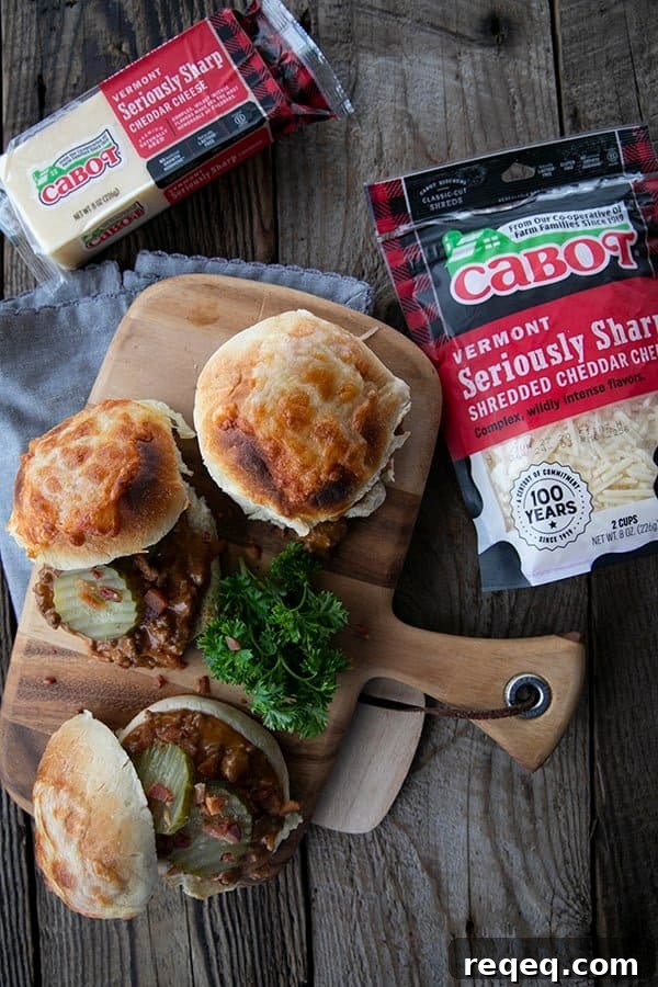 Classic Homemade Sloppy Joes Recipe for Juicy Sandwiches 3 rich tomato gravy with melted Cabot cheese and crispy chopped bacon on a toasted bun with dill pickles