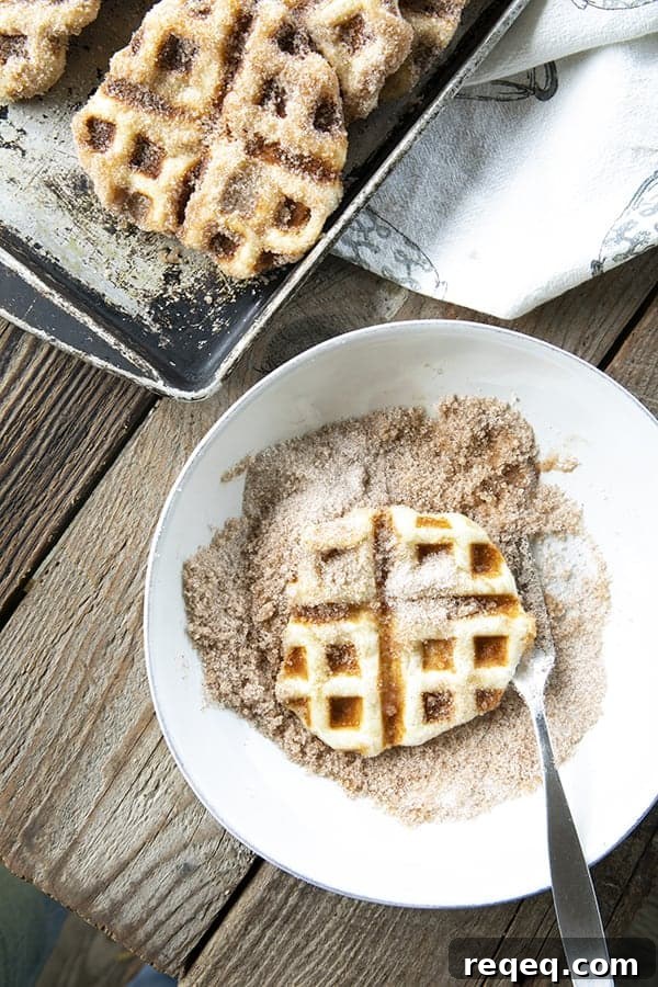 Crispy edged, cinnamon-sugar dusted Churros Waffles are 100% irresistible and ridiculously easy to make, taking advantage of frozen dough for the base. Bonus: No boiling oil!