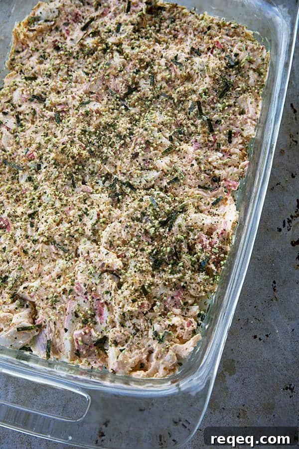 California Roll Sushi Bake Recipe: Creamy Baked Sushi Casserole 4 Sushi Bake creamy crab layer with furikake in glass pan