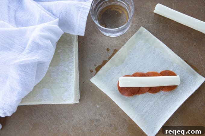 Buffalo Pizza Logs: Classic New York Snack Recipe 5 Pizza Logs are crispy, crunchy egg rolls filled with gooey, melted mozzarella cheese and garlicky pepperoni. Whether you whip these up in your air fryer, oven, or in a frying pan, you'll want these not just for game day, but all the time!