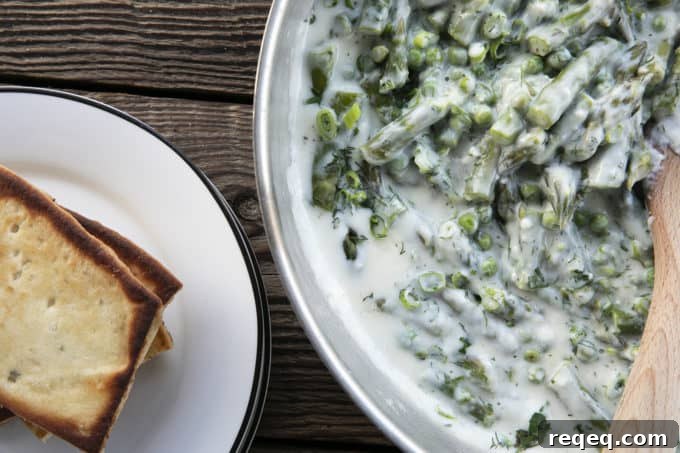 Tender spring peas and asparagus combine in a garden herb cream sauce in this new-fashioned take on delightfully old-fashioned Creamed Peas. Served over toast, this is one simple, economical dish wows!