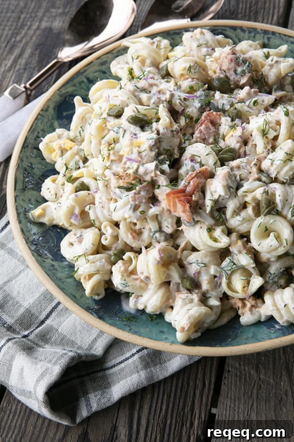 Smoked Salmon Pasta Salad is about to become your new favourite pasta salad. Savoury smoked salmon, a simple creamy dill dressing, hard-boiled eggs, capers, and red onions combine to amp up pasta salad to a whole new level. You'll find yourself craving this!