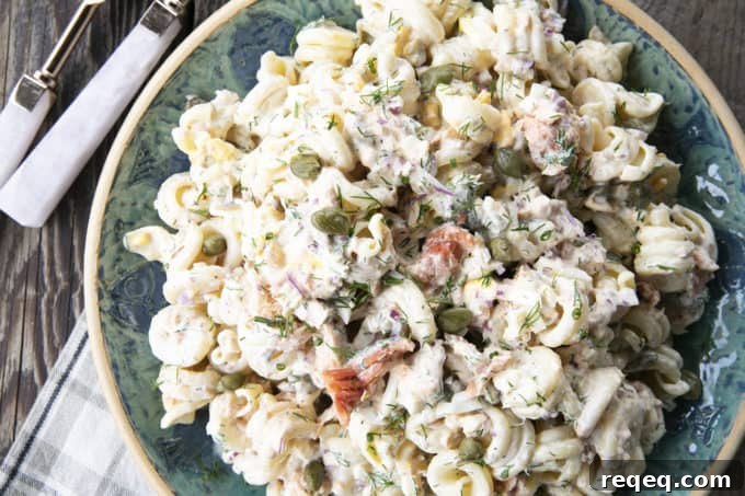 Smoked Salmon Pasta Salad is about to become your new favourite pasta salad. Savoury smoked salmon, a simple creamy dill dressing, hard-boiled eggs, capers, and red onions combine to amp up pasta salad to a whole new level. You'll find yourself craving this!