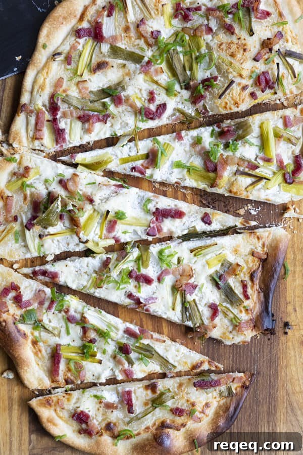 Flammekueche, tarte Flambée, or flammkuchen is a fast and easy bacon and onion pizza type flatbread made with crème fraîche or sour cream. No yeast needed!