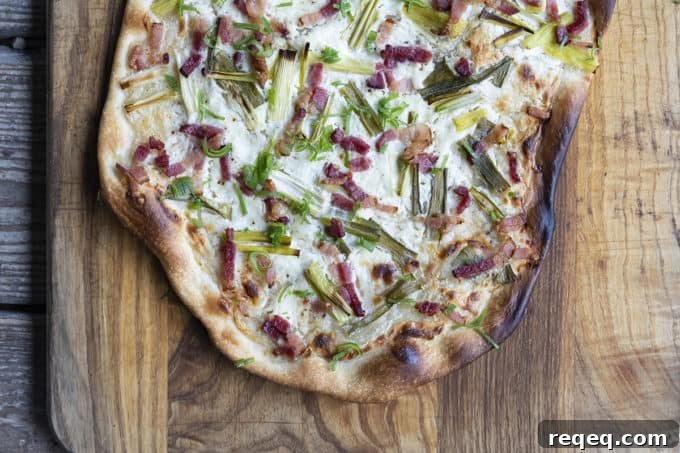 Flammekueche, tarte Flambée, or flammkuchen is a fast and easy bacon and onion pizza type flatbread made with crème fraîche or sour cream. No yeast needed!