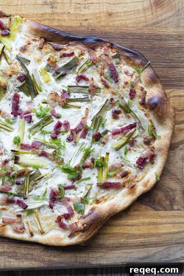 Flammekueche, tarte Flambée, or flammkuchen is a fast and easy bacon and onion pizza type flatbread made with crème fraîche or sour cream. No yeast needed!