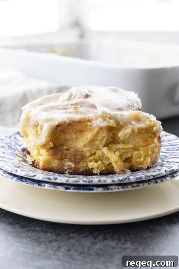 Carrot Cake Cinnamon Rolls with Cream Cheese Glaze 2 Carrot Cake Rolls are big, FLUFFY AS A CLOUD, & positively studded with super fine shreds of sweet carrots before being rolled up around a spiced buttery brown sugar filling.