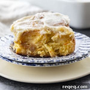 Carrot Cake Rolls are big, FLUFFY AS A CLOUD, & positively studded with super fine shreds of sweet carrots before being rolled up around a spiced buttery brown sugar filling.