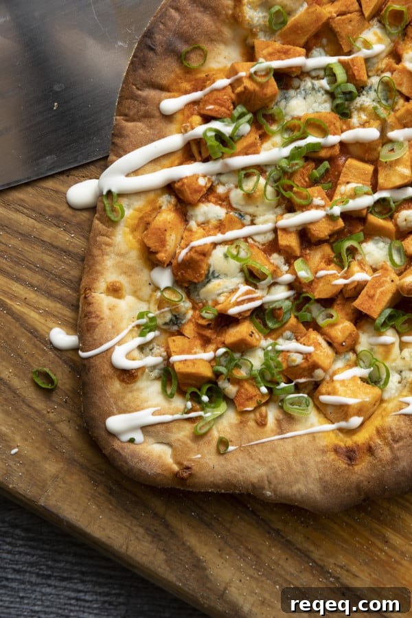 Tender cubes of Spicy Buffalo chicken, blue cheese crumbles or another cheese of your choice, thinly sliced green onions, and a drizzle of blue cheese dressing or ranch dressing top flatbread proving that great food doesn't have to be complicated! Buffalo Chicken Flatbread is equally fabulous as a great appetizer for game day or as an easy dinner.