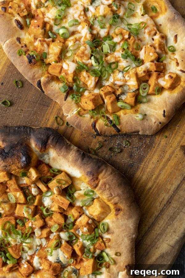 Tender cubes of Spicy Buffalo chicken, blue cheese crumbles or another cheese of your choice, thinly sliced green onions, and a drizzle of blue cheese dressing or ranch dressing top flatbread proving that great food doesn't have to be complicated! Buffalo Chicken Flatbread is equally fabulous as a great appetizer for game day or as an easy dinner.