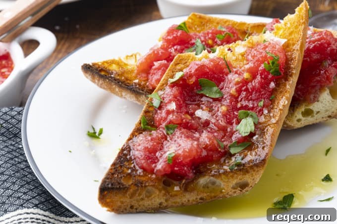 Spanish Tomato Toast: Classic Pan con Tomate Recipe for Brunch 3 Pan con Tomate on a plate, ready to serve.