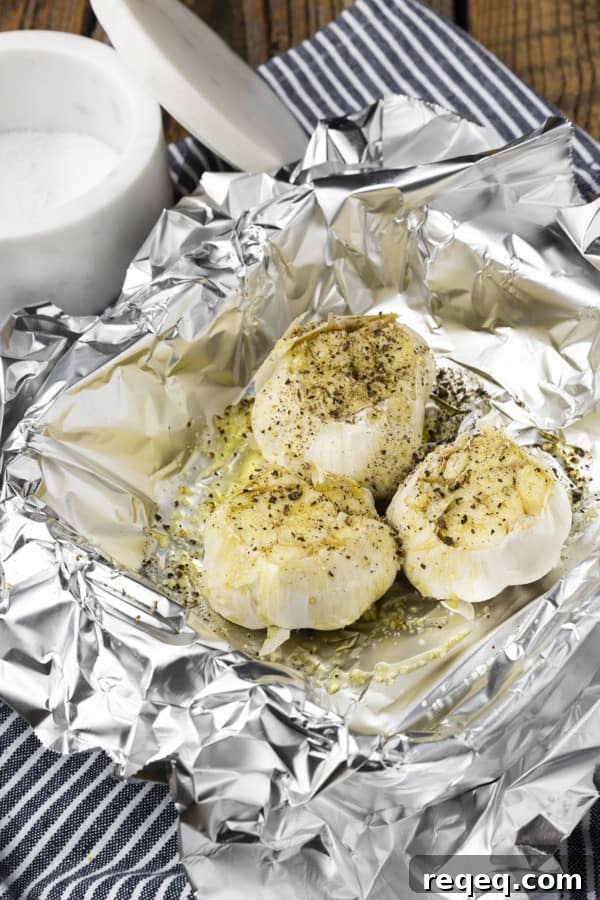 Crispy Air-Fryer Roasted Garlic: Sweet, Caramelized Cloves 4 Garlic heads wrapped in foil ready for the air fryer
