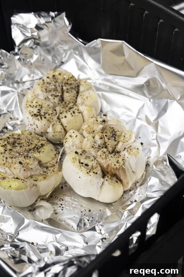 Crispy Air-Fryer Roasted Garlic: Sweet, Caramelized Cloves 5 Roasted garlic ready to squeeze into a bowl