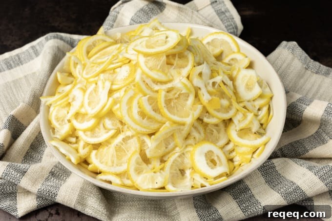 Thinly slice lemons for cheong.