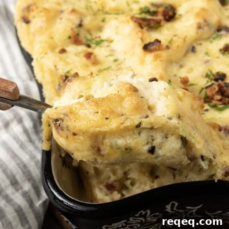 Get ready to dig into a baking dish filled with piping hot, irresistibly golden crusted, super creamy Twice Baked Mashed Potatoes.