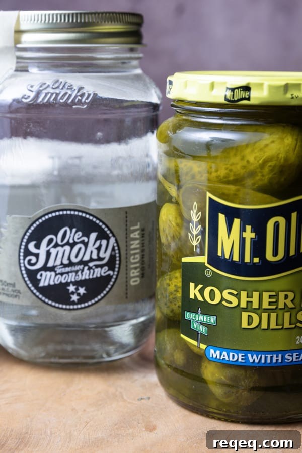 Moonshine Pickles Recipe: How to Make Boozy Canned Cucumbers 3 Pickles soaking in moonshine create a crunchy, boozy snack.