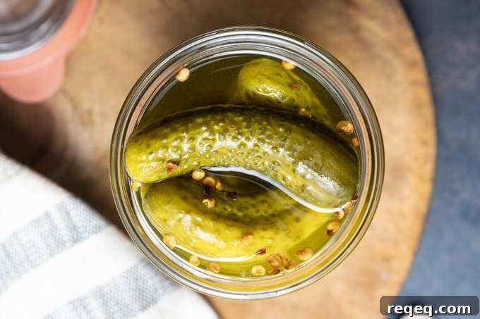 Moonshine Pickles Recipe: How to Make Boozy Canned Cucumbers 4 A jar of pickles ready to be transformed into moonshine pickles.