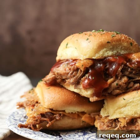 Smoky Pulled Pork Sliders with Tangy BBQ Sauce 11 Easy Pulled Pork Sliders: Pillowy rolls filled with delicious, mouth-watering, tender pulled pork, bbq sauce, and cheese are brushed with melted butter, garlic, and herbs, then baked to toasty, melty perfection. They’re like the little black dress of the sandwich world and perfect for every occasion. Bonus: They're done in 30 minutes from start to finish!