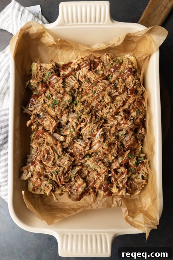 Smoky Pulled Pork Sliders with Tangy BBQ Sauce 7 Easy Pulled Pork Sliders: Pillowy rolls filled with delicious, mouth-watering, tender pulled pork, bbq sauce, and cheese are brushed with melted butter, garlic, and herbs, then baked to toasty, melty perfection. They’re like the little black dress of the sandwich world and perfect for every occasion. Bonus: They're done in 30 minutes from start to finish!