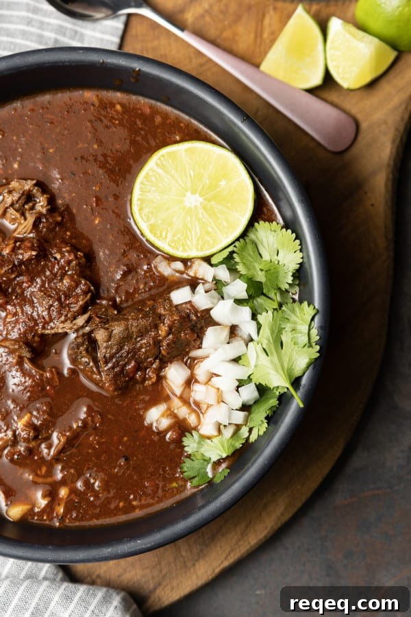 Instant Pot Birria Tacos: Tender Meat in Rich Consommé 5 Crispy quesabirria tacos served with birria consommé for dipping.