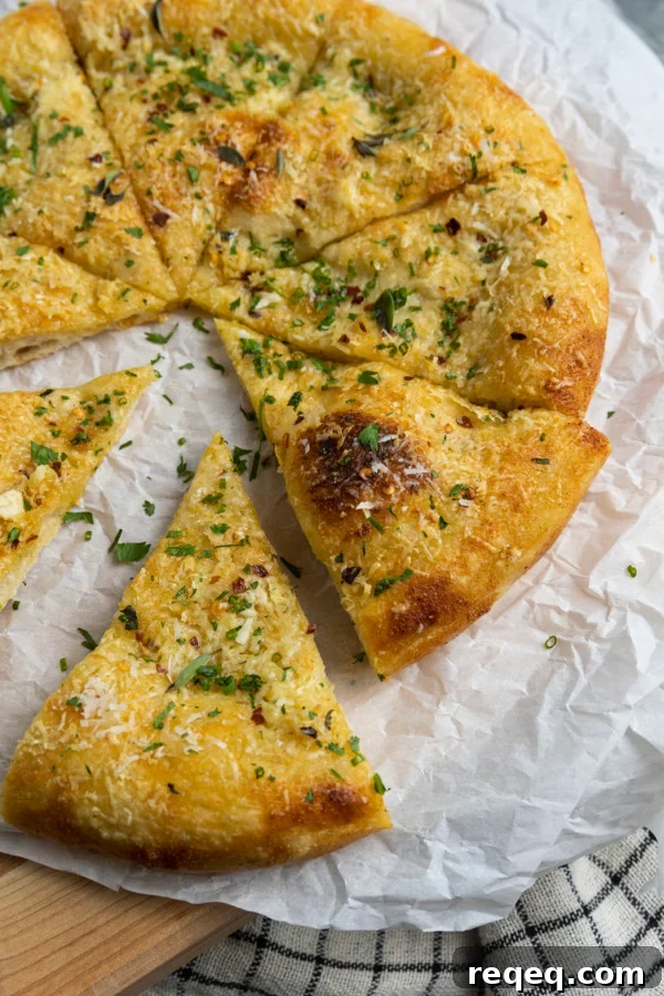 Garlic pizza on a wooden board