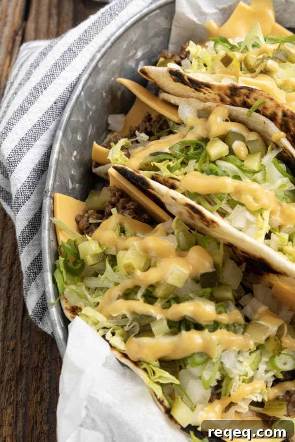 Big Mac–Style Tacos: Copycat Recipe for the Classic Flavor 3 Big Mac Tacos: seasoned beef, special sauce, lettuce, cheese, pickles, and onions on a sesame-style tortilla.
