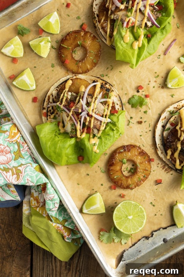 Jerk Chicken Tacos with Pineapple Salsa & Lime Crema 2 Make taco nights magical with jerk chicken tacos! Fresh lettuce leaves stacked on charred tortillas are piled high with juicy jerk chicken, grilled pineapple slices, diced bell peppers, thinly sliced onions, a drizzle of sauce or spoonful of mango salsa.
