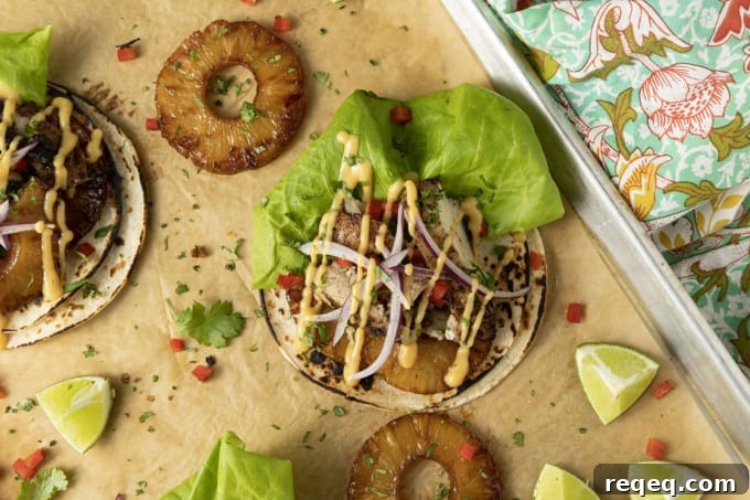 Jerk Chicken Tacos with Pineapple Salsa & Lime Crema 4 Make taco nights magical with jerk chicken tacos! Fresh lettuce leaves stacked on charred tortillas are piled high with juicy jerk chicken, grilled pineapple slices, diced bell peppers, thinly sliced onions, a drizzle of sauce or spoonful of mango salsa.