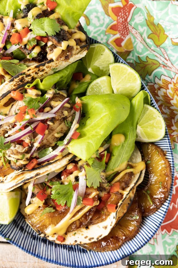 Jerk Chicken Tacos with Pineapple Salsa & Lime Crema 7 Make taco nights magical with jerk chicken tacos! Fresh lettuce leaves stacked on charred tortillas are piled high with juicy jerk chicken, grilled pineapple slices, diced bell peppers, thinly sliced onions, a drizzle of sauce or spoonful of mango salsa.