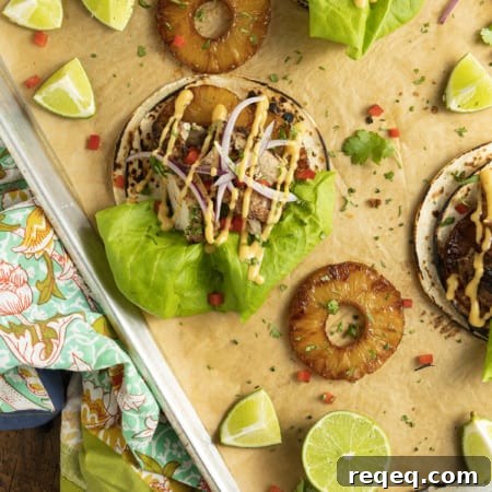 Jerk Chicken Tacos with Pineapple Salsa & Lime Crema 10 Make taco nights magical with jerk chicken tacos! Fresh lettuce leaves stacked on charred tortillas are piled high with juicy jerk chicken, grilled pineapple slices, diced bell peppers, thinly sliced onions, a drizzle of sauce or spoonful of mango salsa.