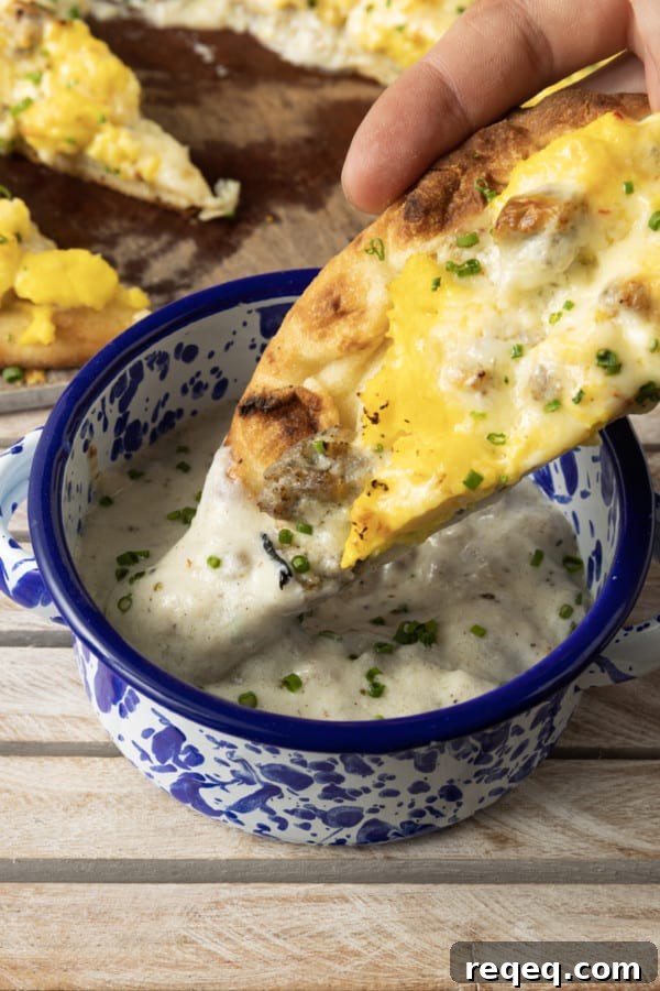 Final baked sausage gravy breakfast pizza garnished with chives