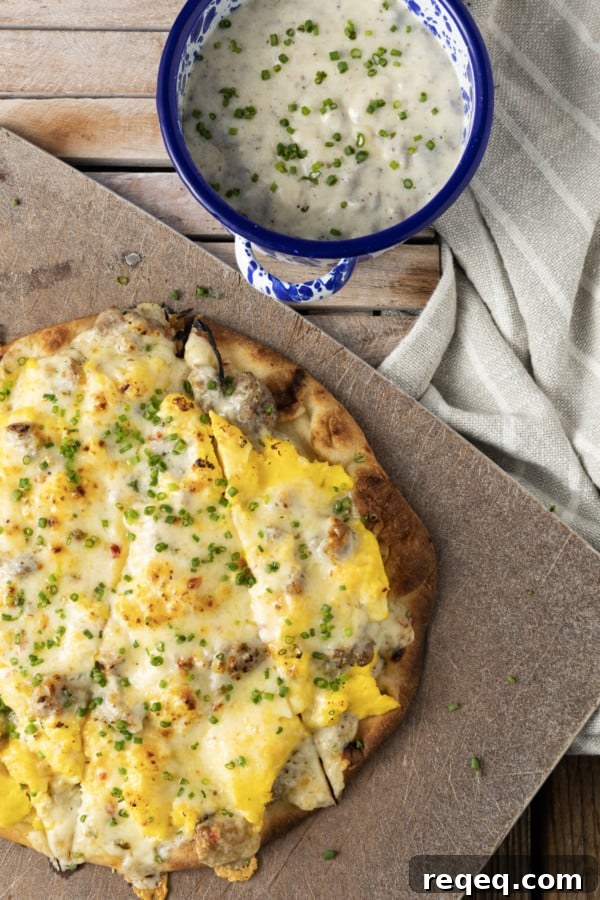 Sausage gravy spread over a pizza crust with eggs and cheese.