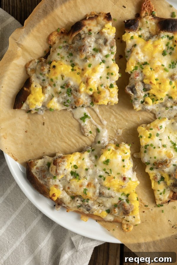 Assembled breakfast pizza being prepared for the oven