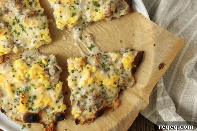 Baked sausage gravy breakfast pizza on a pan