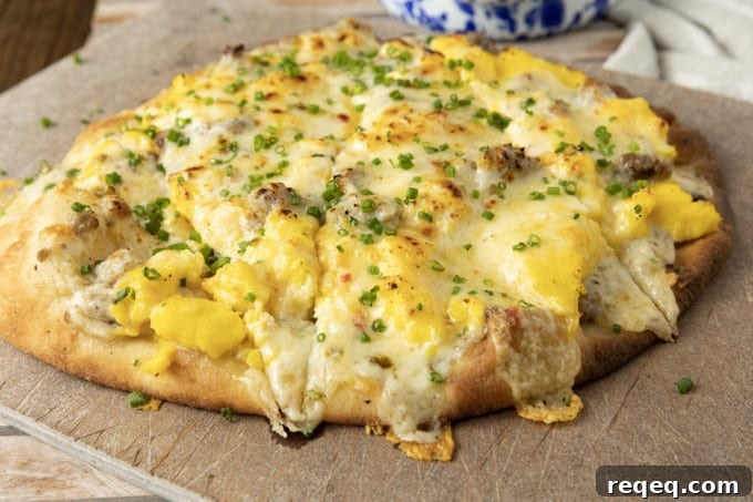 Sausage gravy bubbling on a breakfast pizza