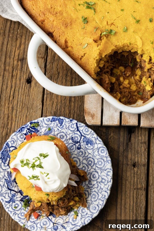 Cheesy Pulled Pork Casserole with Crispy Topping 2 Pulled Pork Casserole - saucy pulled pork with black beans and corn baked under golden cornbread.