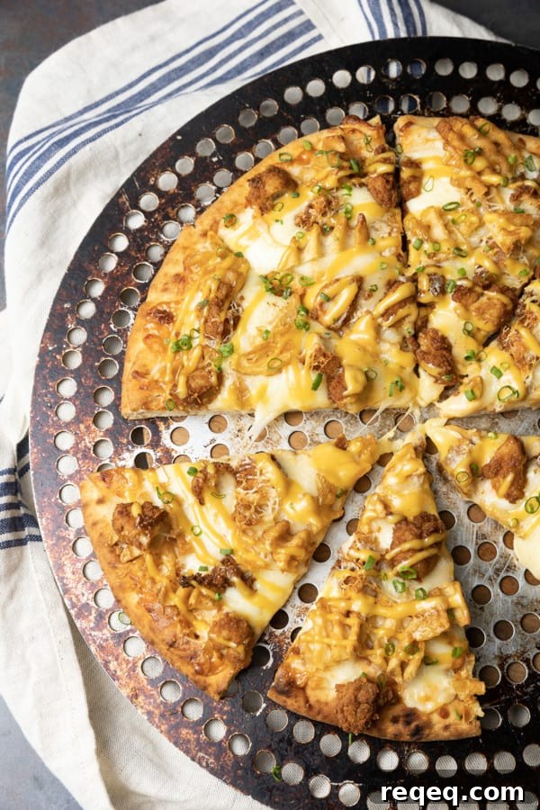 Chick Fil A Pizza topped with nuggets and waffle fries