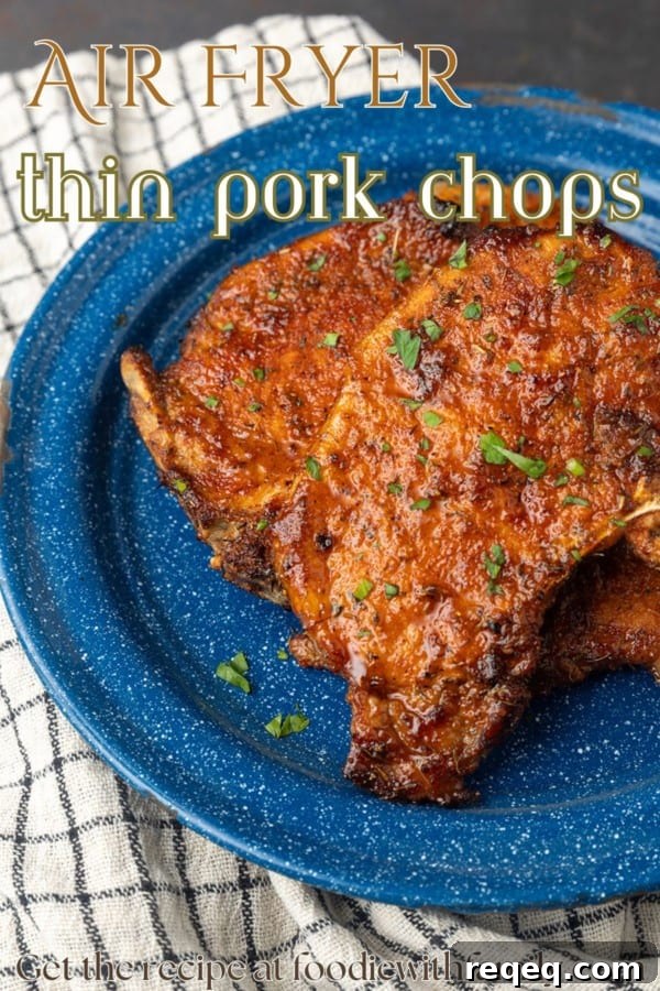 Crispy Air Fryer Thin Pork Chops in 15 Minutes 6 thin pork chops on blue plate with text overlay describing the photo